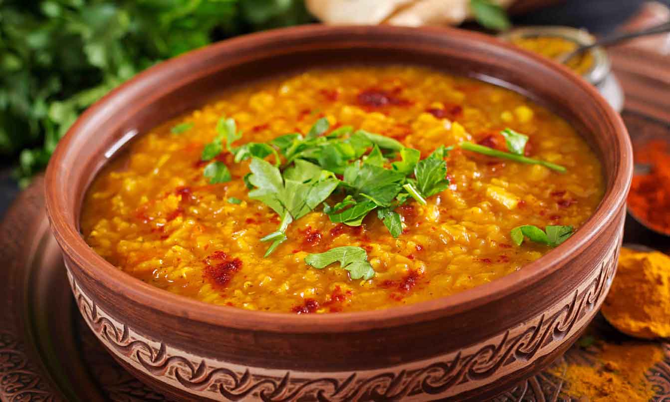 indian-dhal-spicy-curry-bowl-spices-herbs-rustic-black-wooden-table-1-1